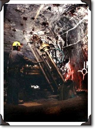 Underground PHoto of Miner doing his thing - taken with Bowens 750 cans and Bronica ETR (1967)