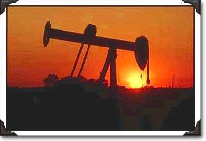 Oil well at sunset, Alberta