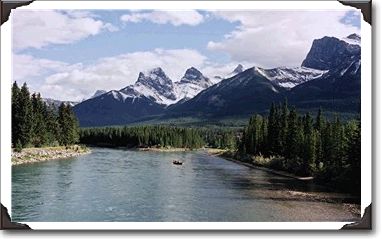 This picture was taken from the Bow River bridge in Canmore, Alberta. I group of guided fly fishermen are on the river.