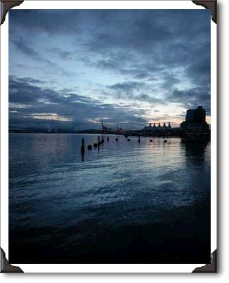 Pre-dawn photo of Burrard Inlet in Vancouver, BC with Canada Place in the background.