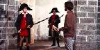 Guards challenge a visitor at entrance to a New France town