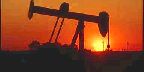 Alberta oil well at sunset.