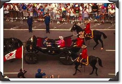 Carriage Mounties and Queen of England in procession detail