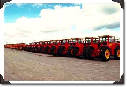 Rows of versatile tractors at plant near Winnipeg, Manitoba